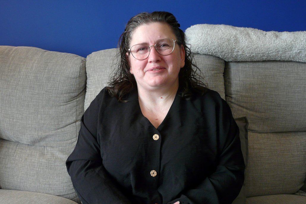 Person sitting on sofa