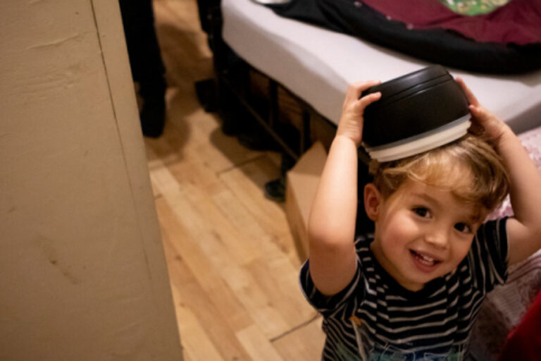 Child with book on head