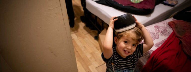 Child with book on head