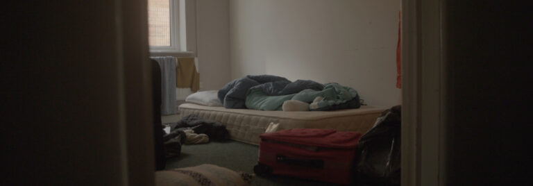 Untidy room with matress on floor
