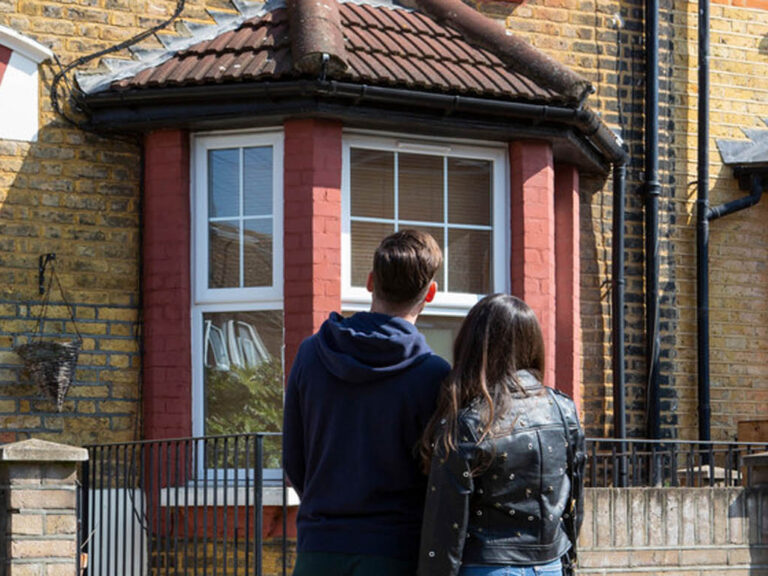 Couple looking at house