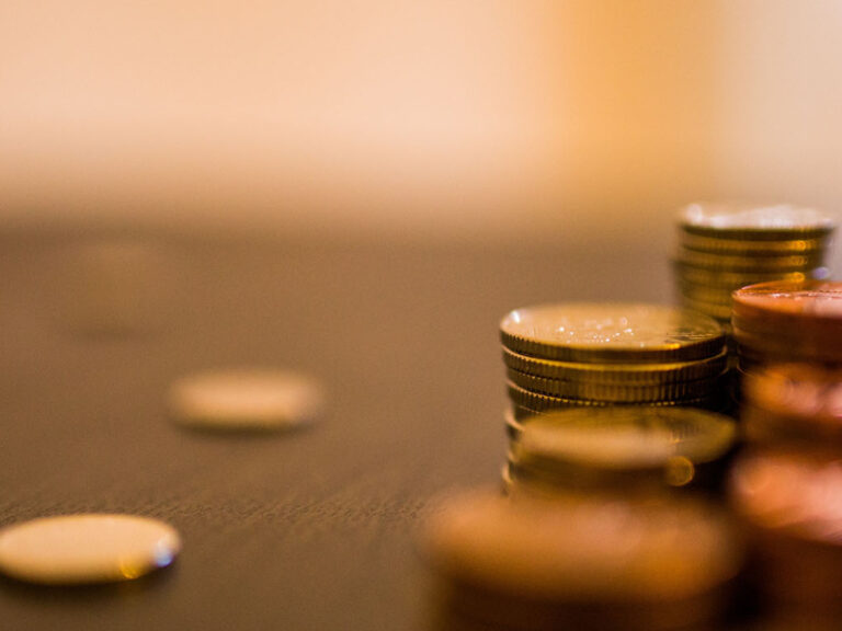 Coins stacked on table