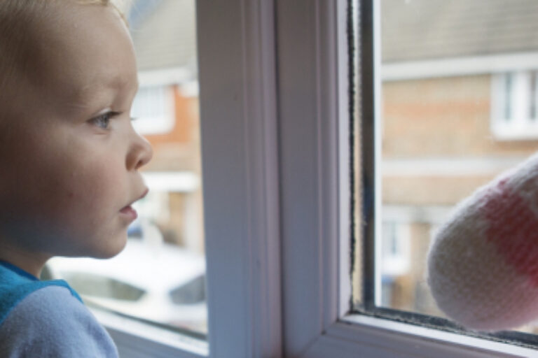 Child looking out window