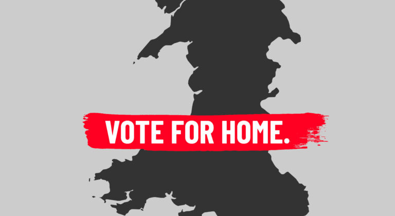 Senedd picture with vote for home text